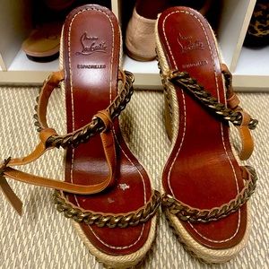 Christian louboutin espadrille wedges with gold chain detail.